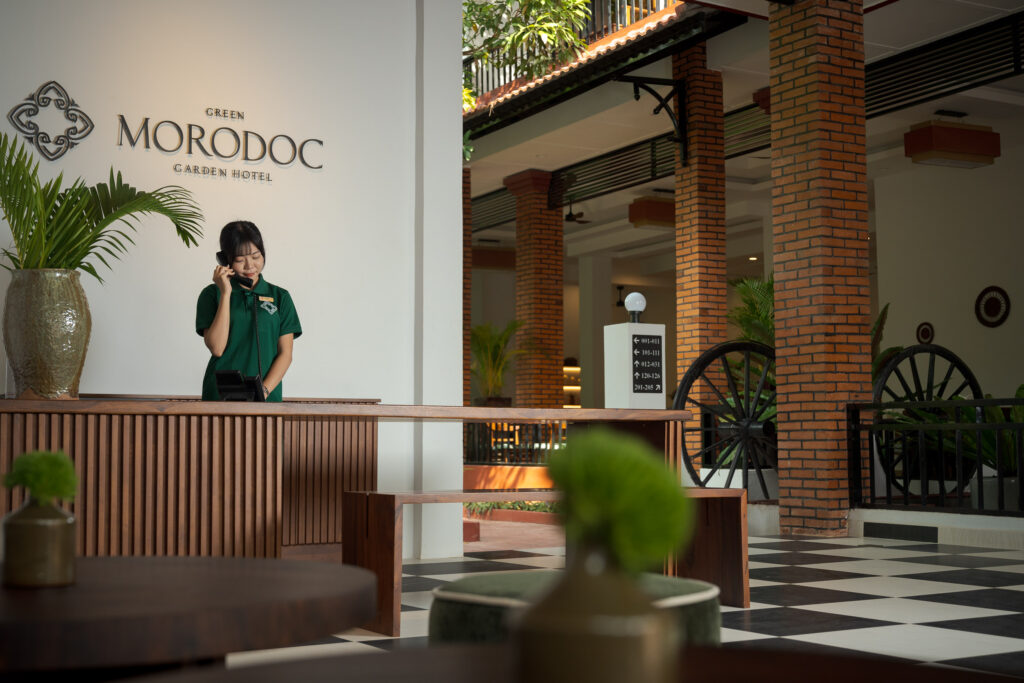 receptionist in lobby of hotel in siem reap, photographed by exposure hotel photography