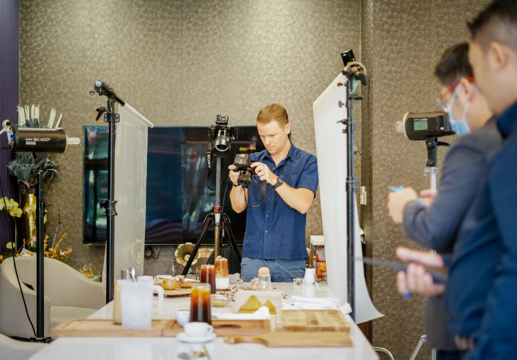 Photographer Geoff Greenwood of Exposure Commercial Photography on a food photoshoot using controlled lighting