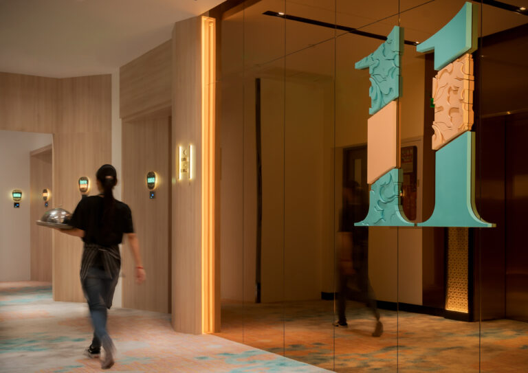 corridor interior at capri by frasfer phnom penh with a member of staff working photographed by exposure photography