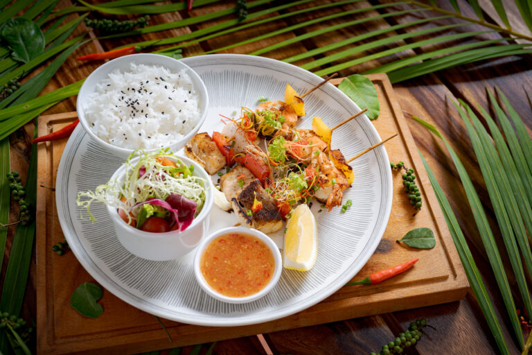 Resort dining dish in Kampot with rice, fresh vegetables and local cuisine – hotel photography Cambodia