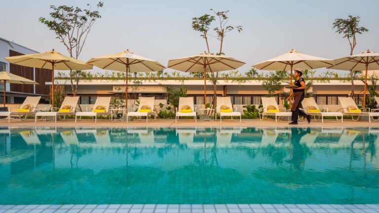 Hotel pool photography Siem Reap Cambodia capturing turquoise water and relaxed boutique hotel atmosphere