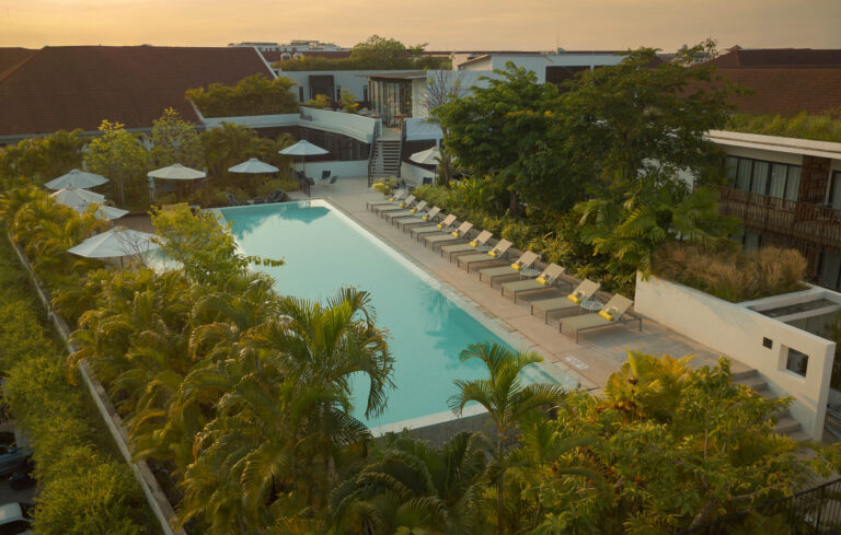 Aerial view of rooftop pool at Aviary Boutique Hotel Siem Reap at sunset