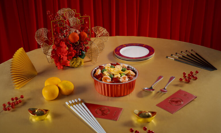 **Alt text:** Chinese New Year restaurant dish with festive red and gold styling